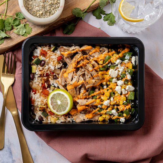 Blackened Chicken & Mexican Street Corn - Shredded blackened chicken thigh with a colorful rice pilaf, black beans, and Mexican street corn topped with Cotija cheese
