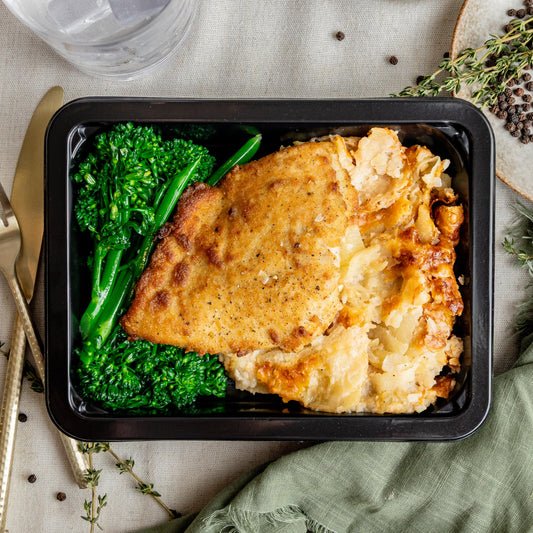 Breaded Chicken & Au Gratin Potatoes - Italian herb-breaded chicken breast with a house-made three-cheese au gratin — layers of Yukon potato, cheddar, mozzarella, and parmesan in…